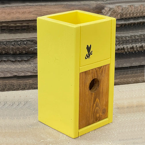 Sunny yellow handcrafted birdhouse planter with bee motif and space for 4-inch potted plant