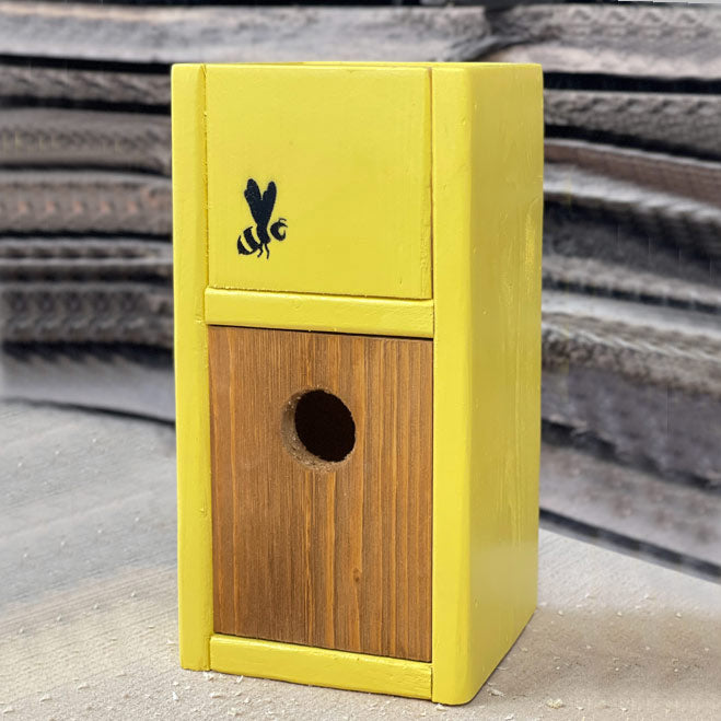 Sunny yellow handcrafted birdhouse planter with bee motif and space for 4-inch potted plant