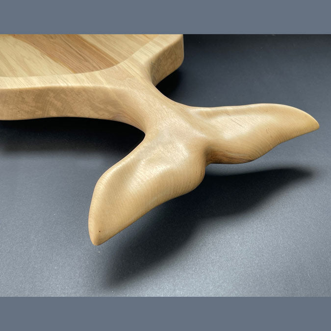 Whale tail handle detail on live edge spalted birch board
