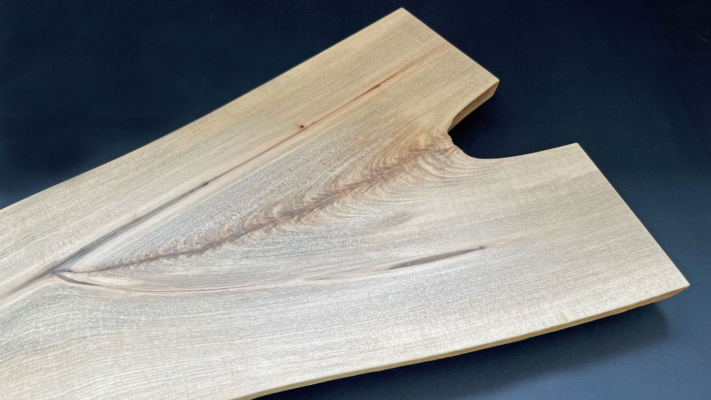 Unique maple charcuterie board with Y-shaped design and live edge detail