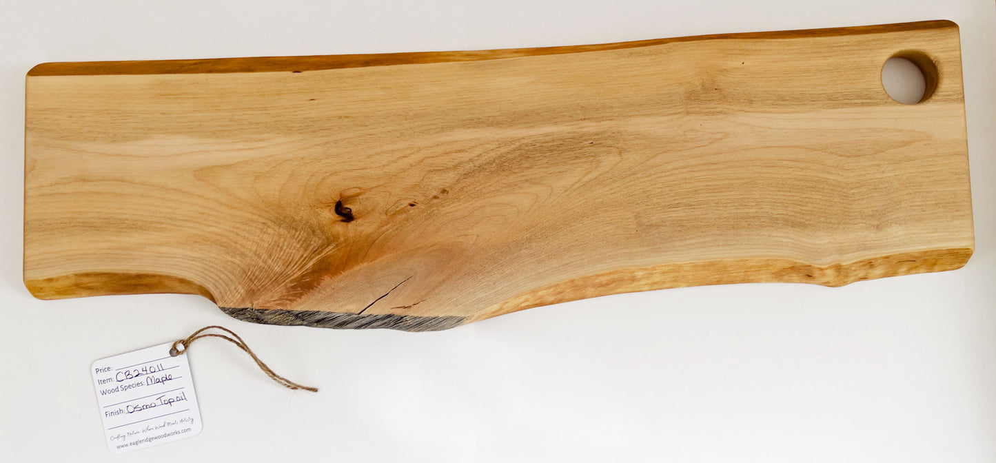 Maple charcuterie board with live edge and round hanging cutout
