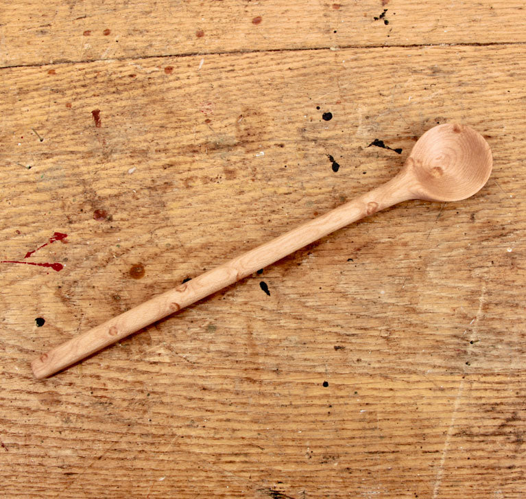 Bird’s eye maple spoon with smooth grain and ergonomic handle