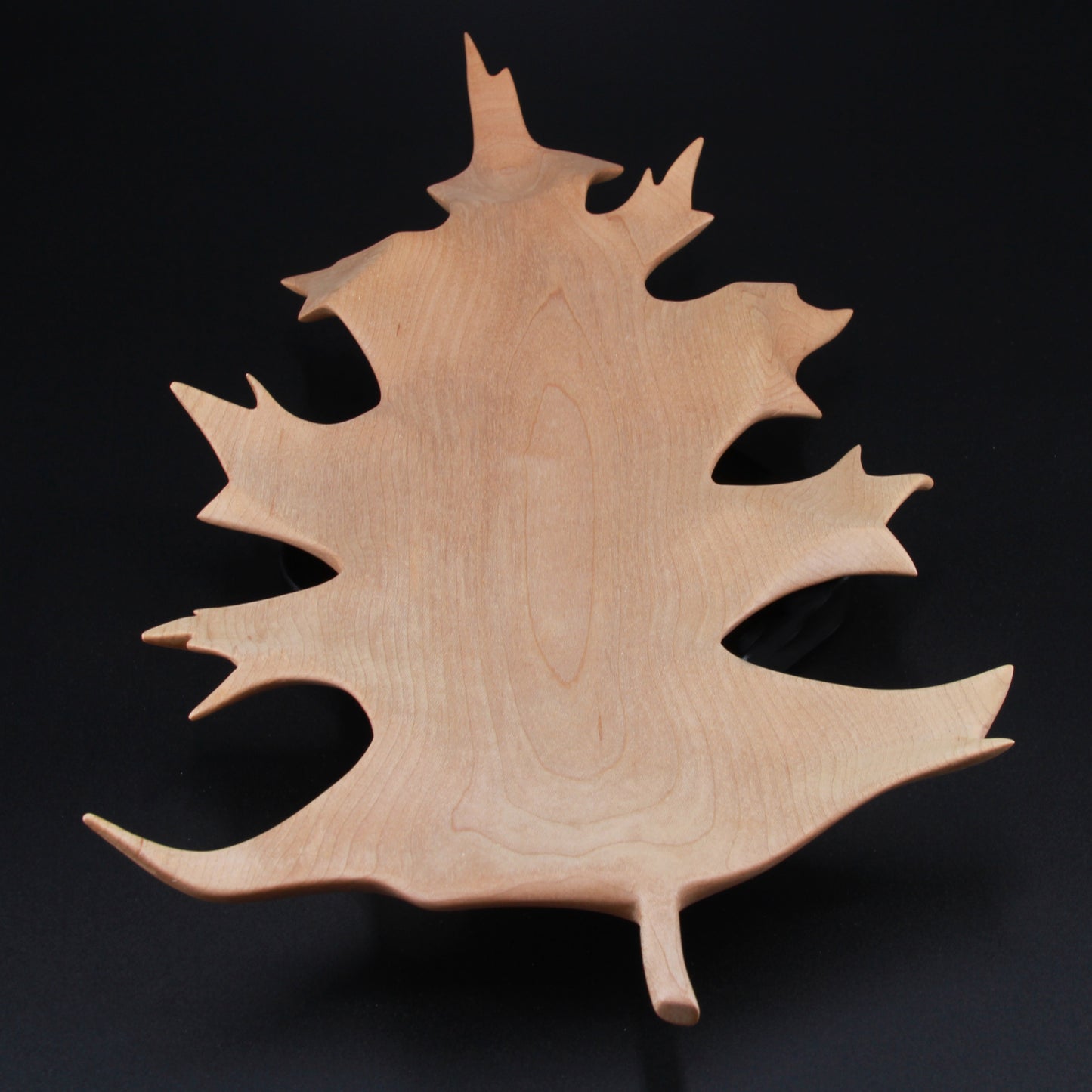 Sculpted wooden oak leaf dish with curved edges and shallow bowl