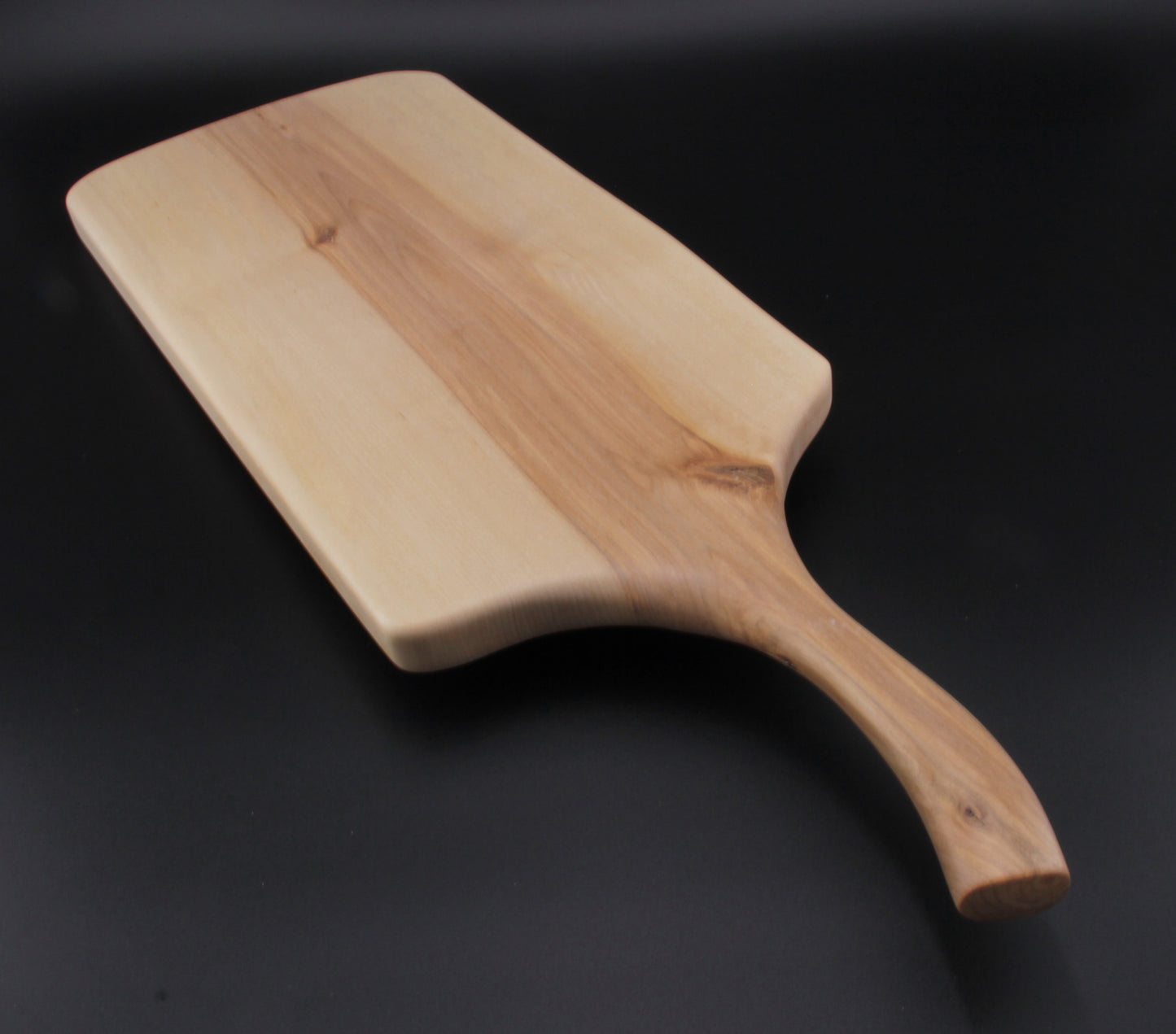 Long ergonomic handle carved from solid birch wood