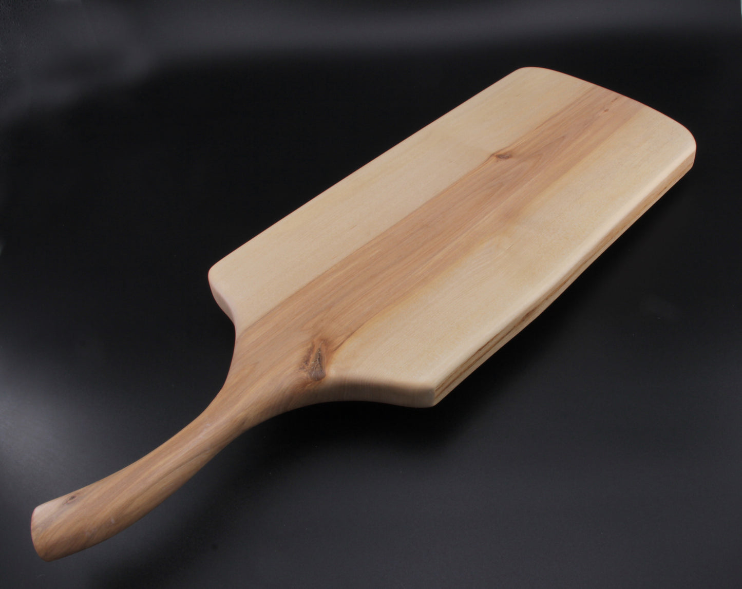 Birch charcuterie board showing smooth finish and organic edge grain