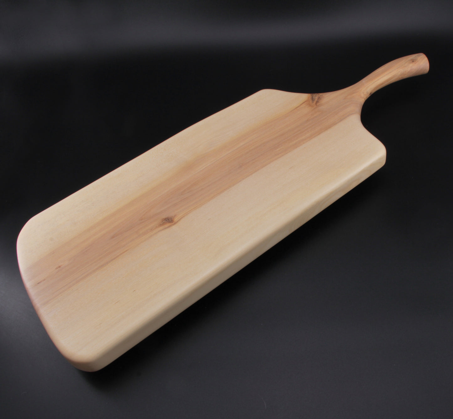 Birch charcuterie board showing smooth finish and organic edge grain