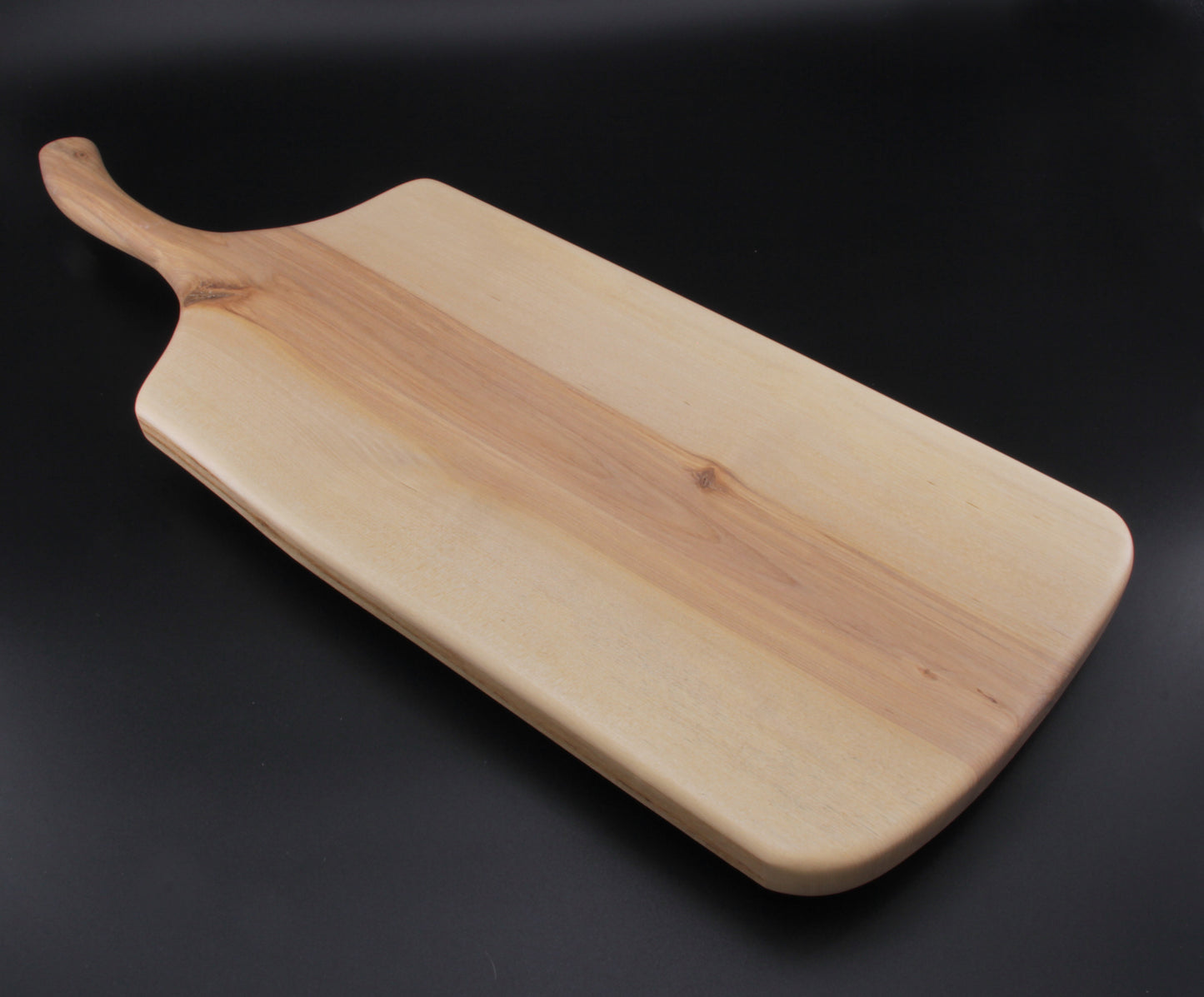 Birch charcuterie board showing smooth finish and organic edge grain