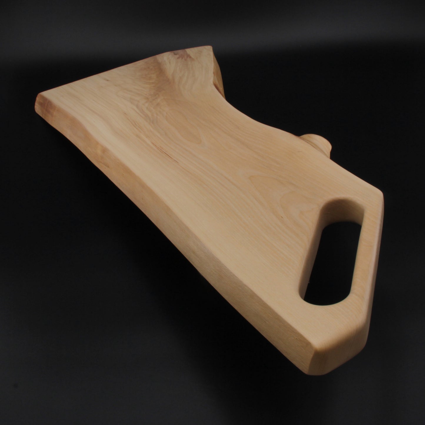 Organic live edge of birch wood with natural grain and shape