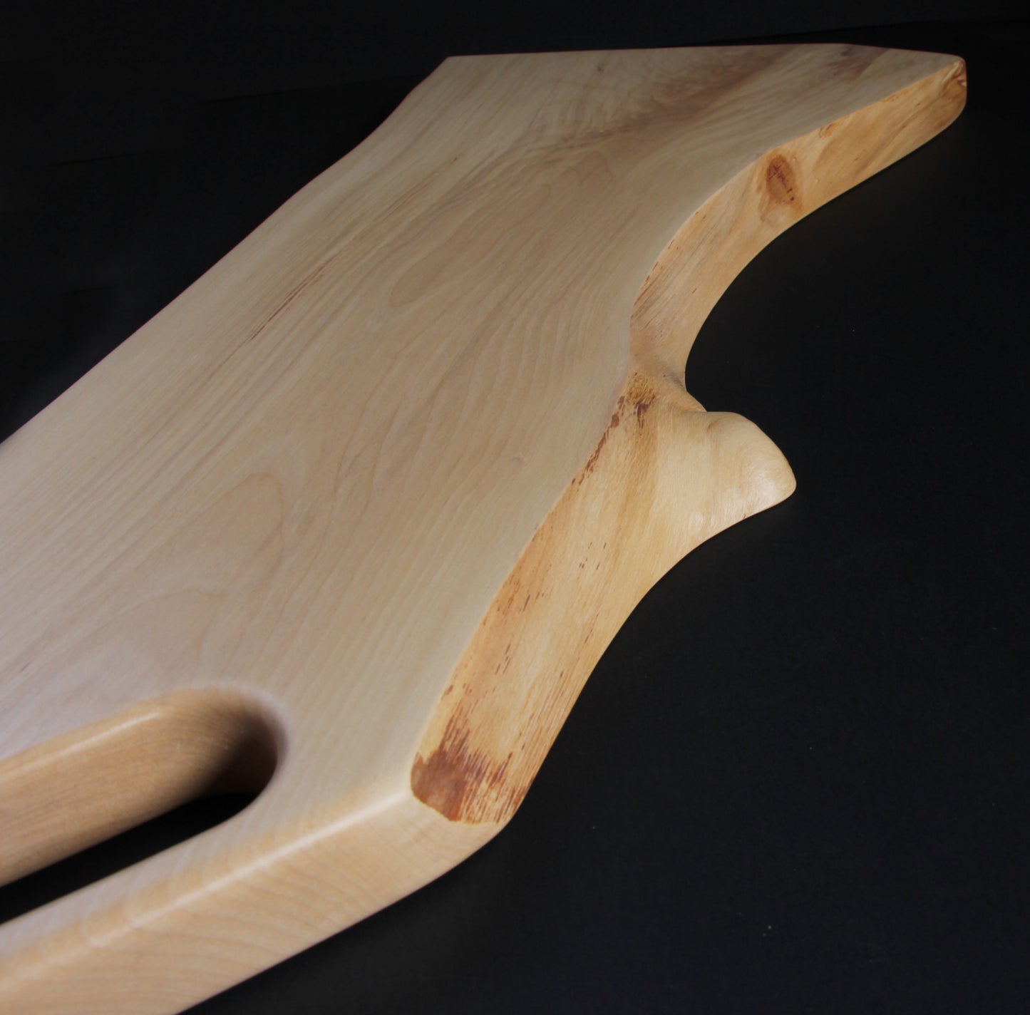 Organic live edge of birch wood with natural grain and shape