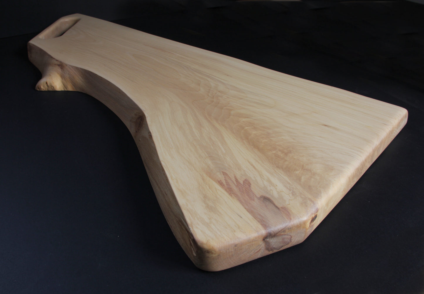 Organic live edge of birch wood with natural grain and shape