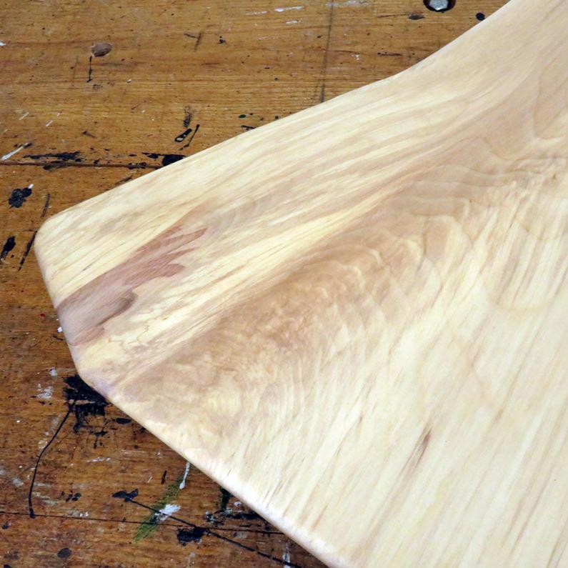 Live edge birch charcuterie board with slot handle and smooth surface finish