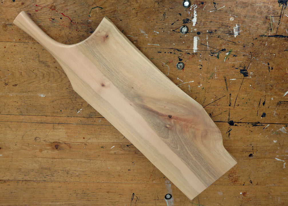 Maple wood serving board with smooth finish and pan handle design