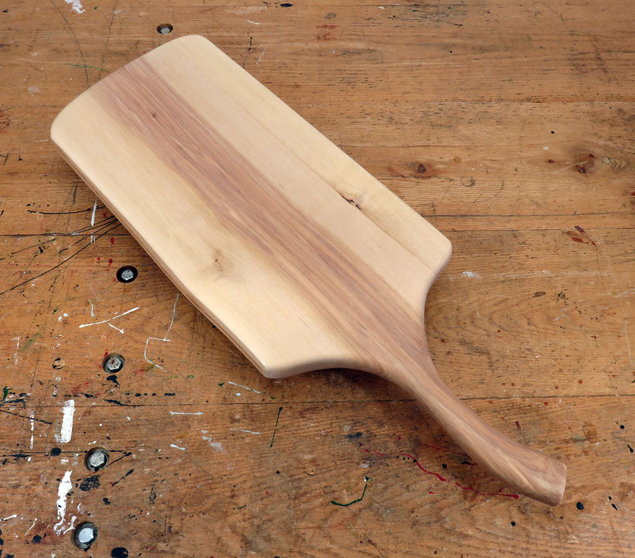 Natural birch wood serving board with rustic live edge and extended handle