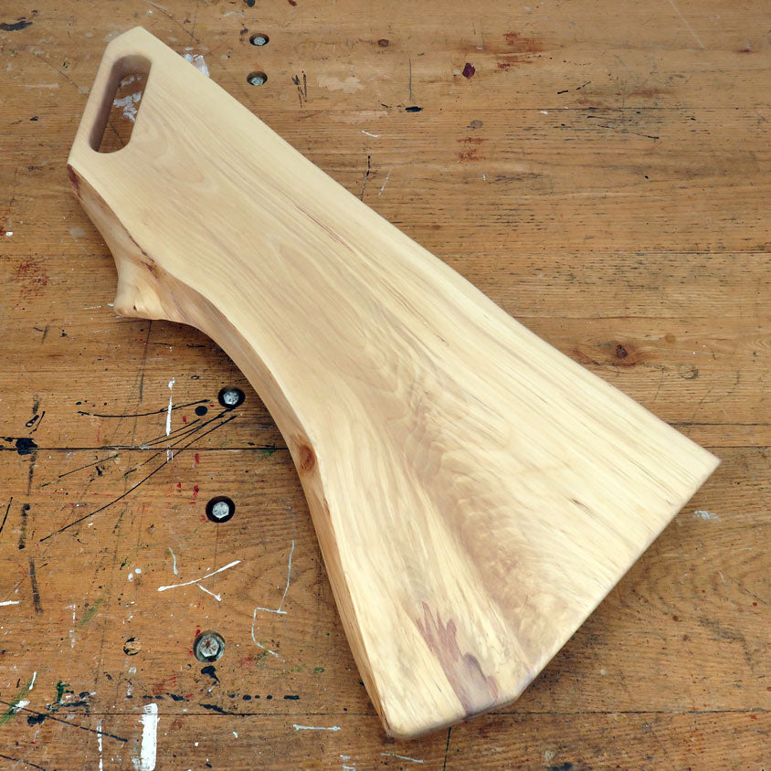 Live edge birch charcuterie board with slot handle and smooth surface finish