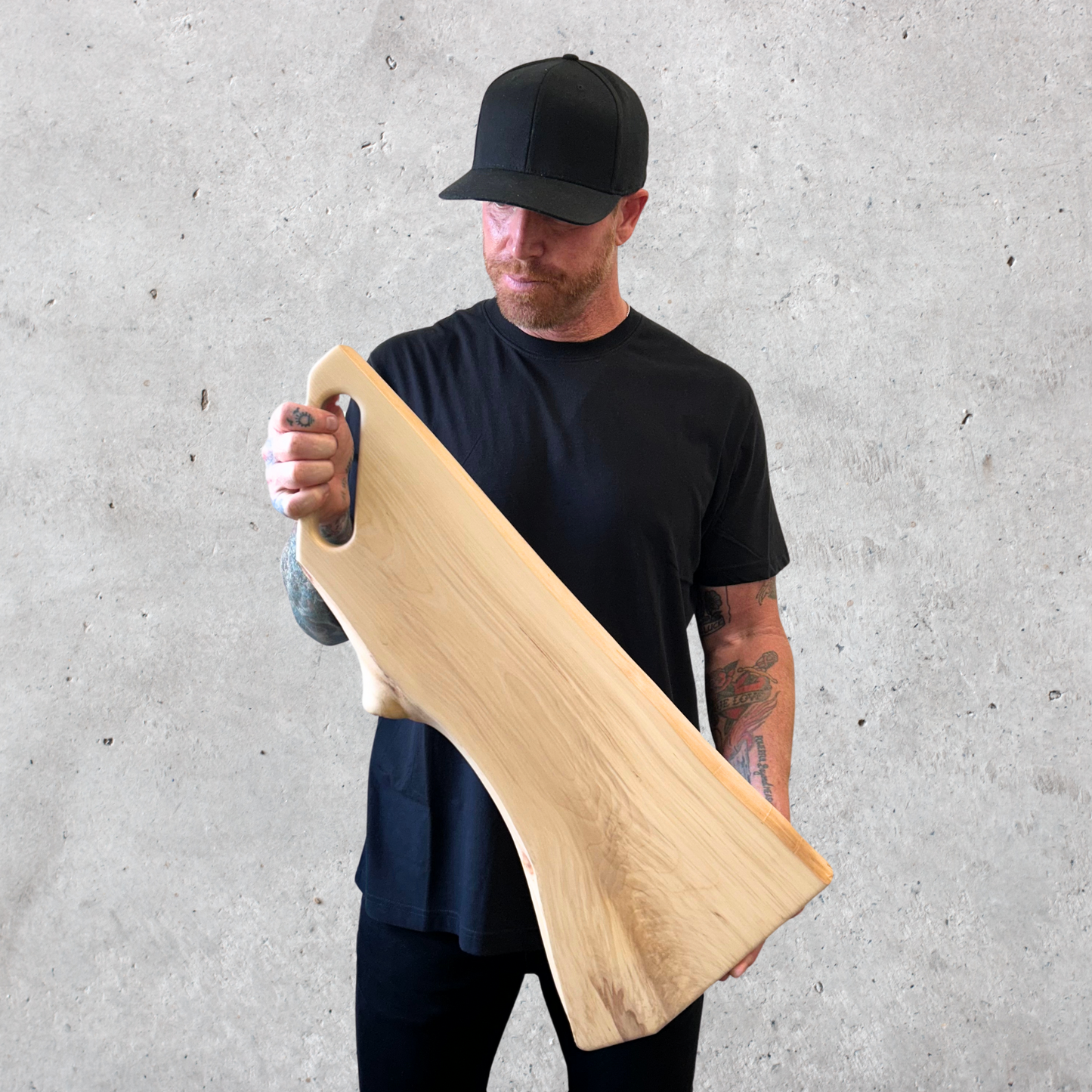 Live edge birch charcuterie board with slot handle and smooth surface finish