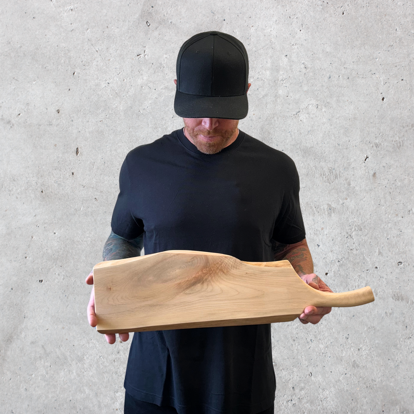 Maple charcuterie board with live edge and pan-style handle