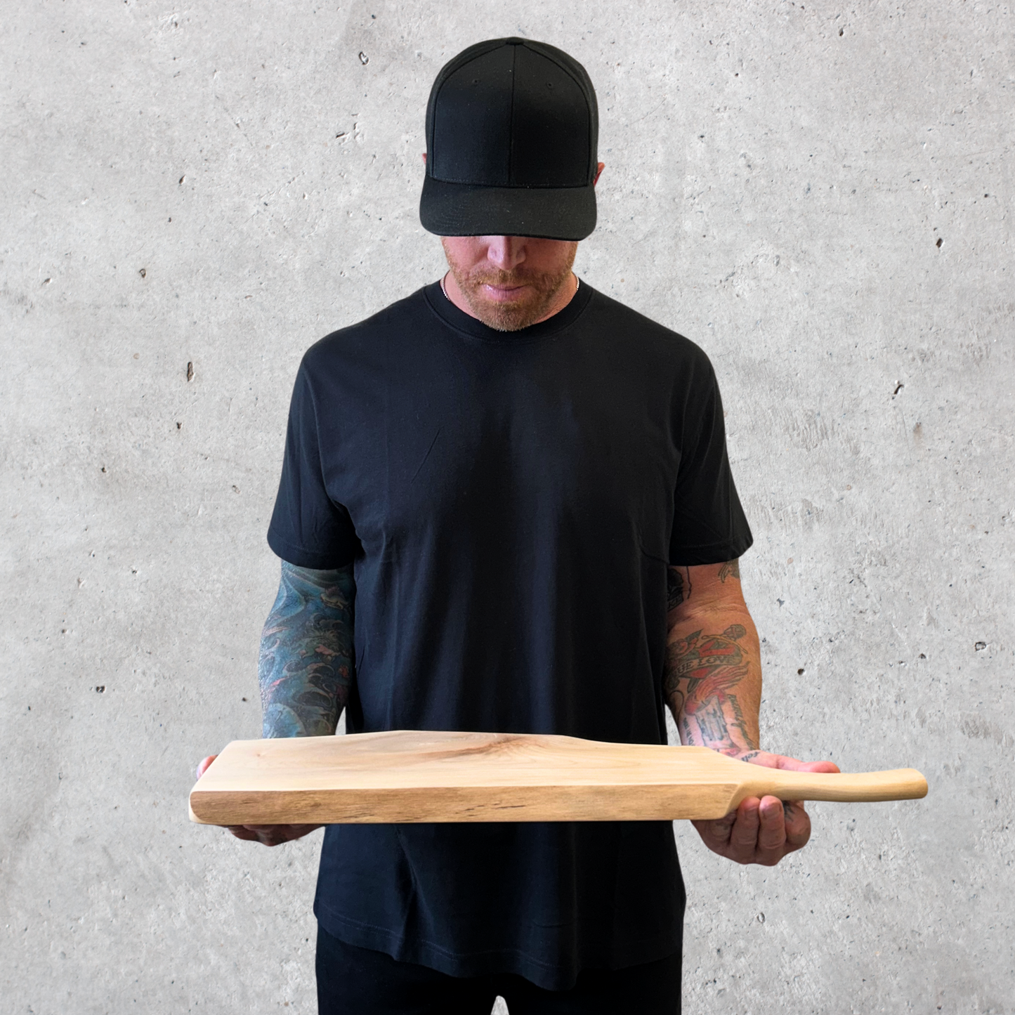 Smooth maple grain with natural live edge on handcrafted board
