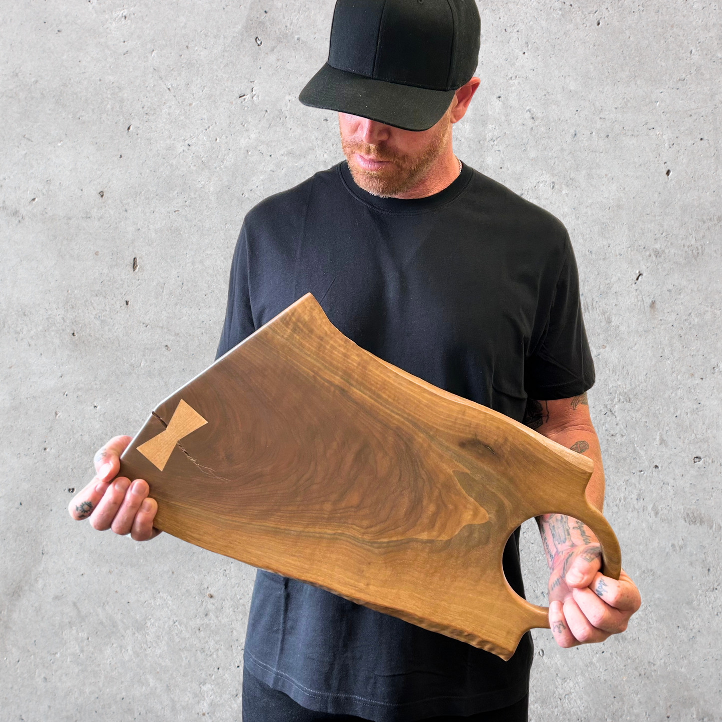 Live edge black walnut charcuterie board with oversized circular handle
