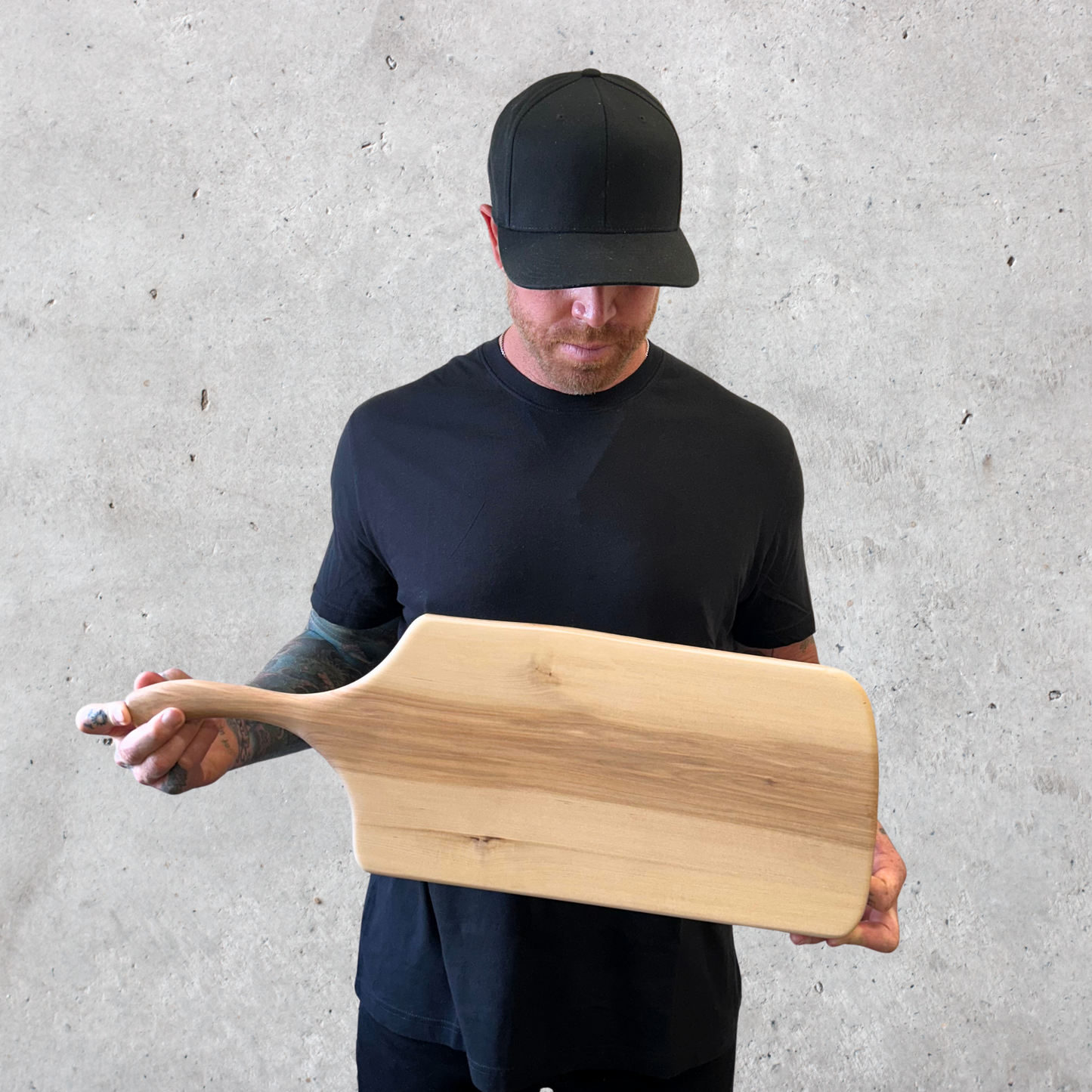 Handcrafted birch charcuterie board with long handle and live edge
